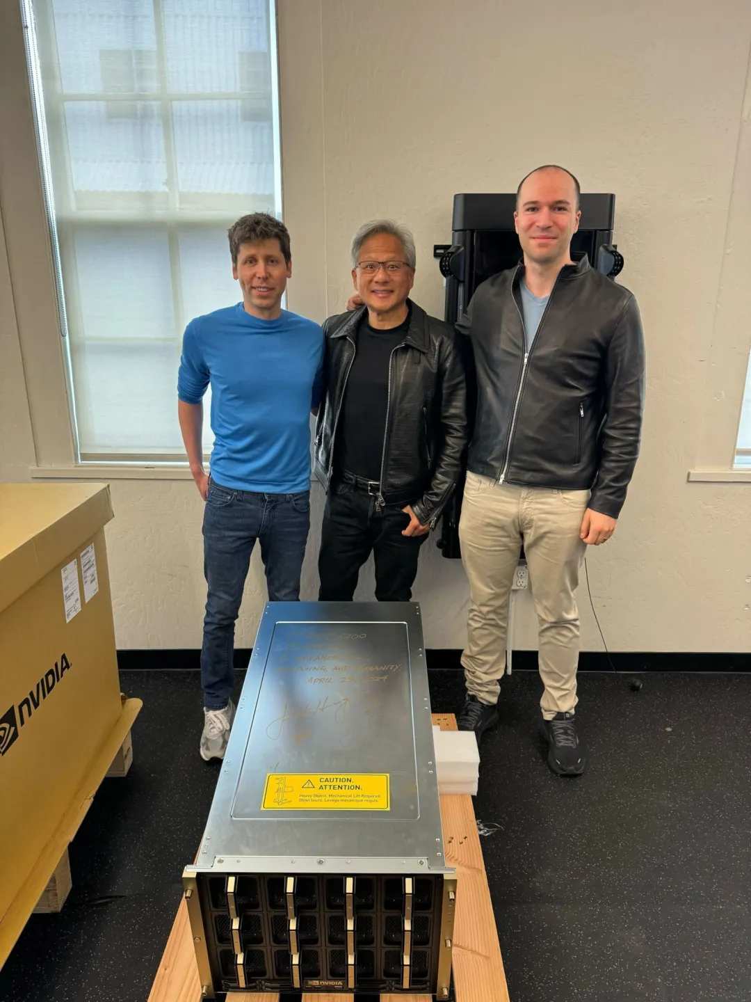 Sam Ultrman, Wong In-hoon and Greg Brockman take a group photo with the DGX-GH200 server